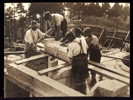 Workmen during construction with carved granite stone, Castle Drogo, Devon