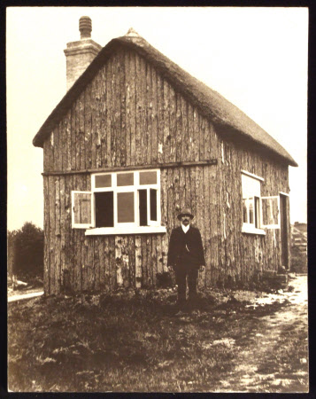 Workman outside Lunchion House, Castle Drogo, Devon