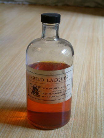 Gold lacquer bottle