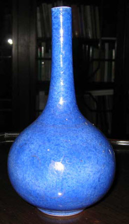 A pair of sprinkler bottles.