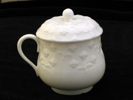 A pair of cups with covers.