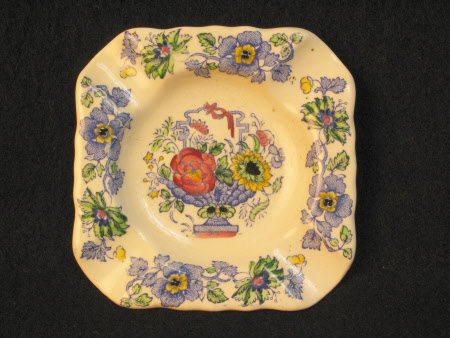 A pair of china ash-trays.