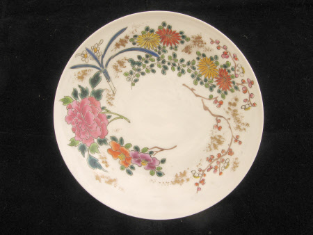 A pair of decorated white china cups, saucers and covers.