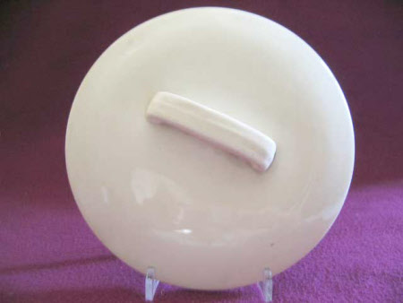 Two circular ceramic dish lids.