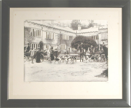 Two huntsman with hounds meeting outside the front of Lanhydrock, Cornwall with family and friends, ...
