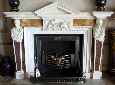Chimneypiece with panel of Androcles and the lion, the sides carved with terminal busts of ...