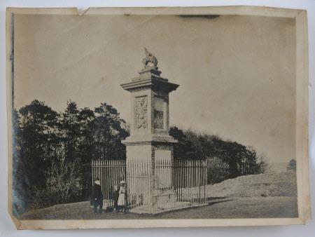 Stone memorial capped with a griffin built in 1720 by John Harvey to commemorate the death of Lord ...