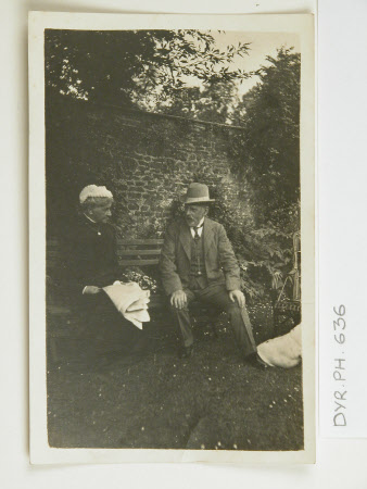 George William Wynter Blathwayt (1853-1934) and lady on bench