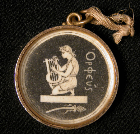 A circular gilt metal locket circa 1890.