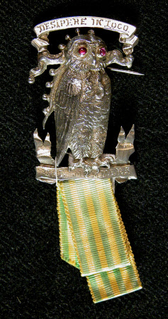 A silver brooch fashioned as an owl with ruby cabochon eyes.