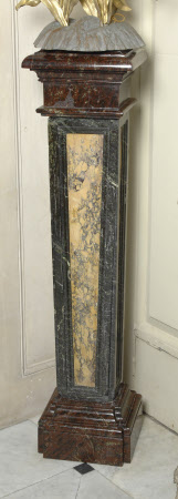 One of a Pair of Marble Plinths, the tapering panelled Pedestals of red, green and yellow Marble 