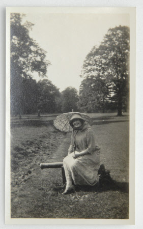 Daphne Maud Adelaide Bankes (1898-1967) with parasol, seated on cannon ...