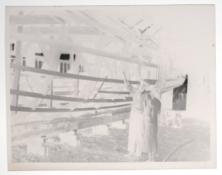 Hilary Margaret Strickland-Constable, Mrs Henry John Ralph Bankes (1908-1966) being shown the hull ...
