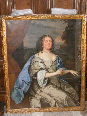 An Unknown Lady in a Grey Dress by a Fountain