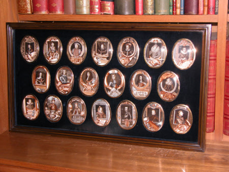 Brown framed case, glazed, of portrait miniature paintings of Kings and Queens of England from ...