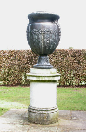 Oviform vase with satyr masks