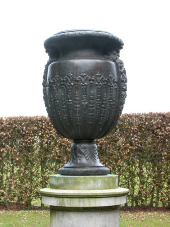 Oviform vase with satyr masks