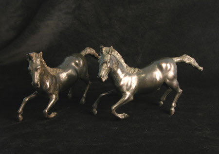A pair of rearing stallions