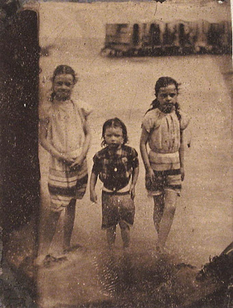Three girls paddling