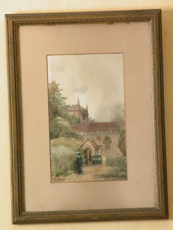 A church with a cleric in the foreground