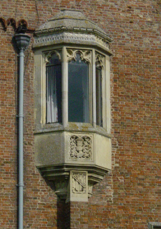 Crest, and helmet with crown above