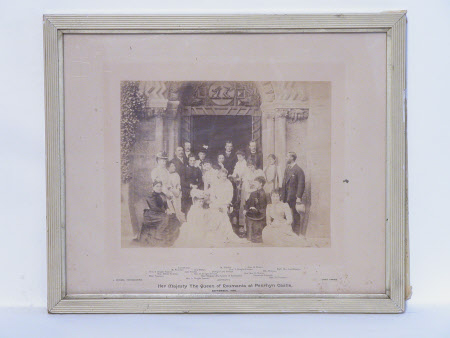Group outside front door of Penrhyn Castle during visit of Queen Elizabeth, Queen of Romania ...