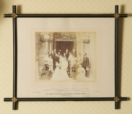 Group outside front door of Penrhyn Castle during visit of Queen Elizabeth, Queen of Romania ...