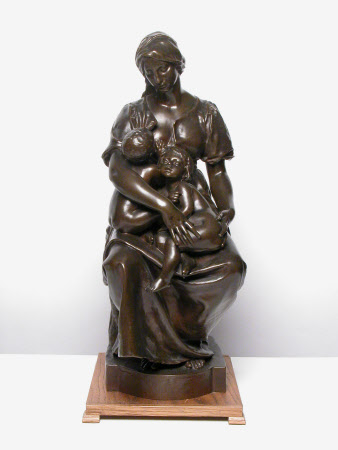 Seated woman with two children, one suckling