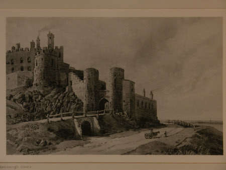 View of Bamburgh Castle from road leading up to it, with pony and trap on the road.