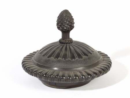 Cover with pinapple finial to the Bacchanalian Urn
