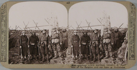 Mud-splashed Lewis machine-gunners at the Junction of the Belgium and our lines at Hollebeke