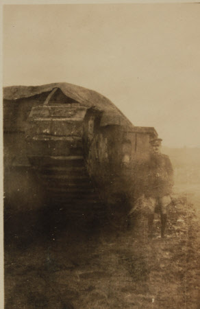 The Hon. Cecil  Edward Agar-Robartes (1892-1939), in uniform, standing beside a large tank, ...
