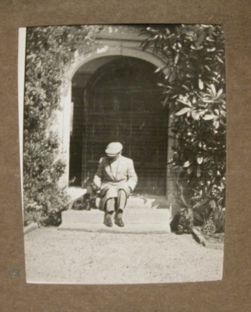 The Hon. Cecil Edward Agar-Robartes (1892-1939) seated on the steps of Lanhydrock House, Cornwall