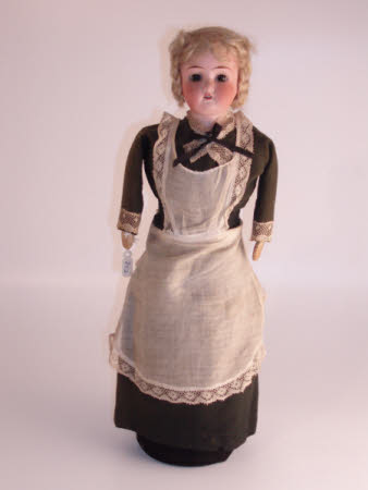 Bisque-headed doorstop doll