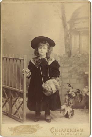 A young girl dressed for winter