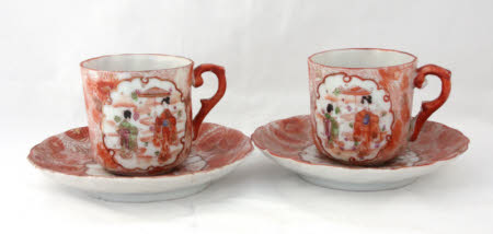 Two coffee cups with saucers.