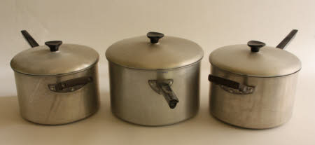 Three metal saucepans and lids.