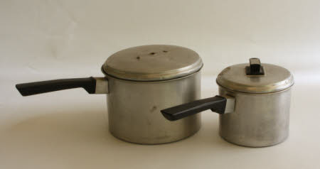 Two saucepans with lids.