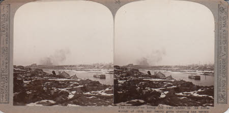 The battlefront along the Yser Canal in the bitter winter of 1916. Our heavy guns shelling the ...