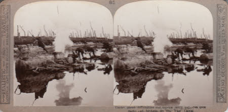 Under great difficulties our troops carry supplies over destroyed bridges on the Yser Canal.