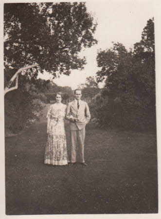 Elizabeth Hussey and man, standing outside
