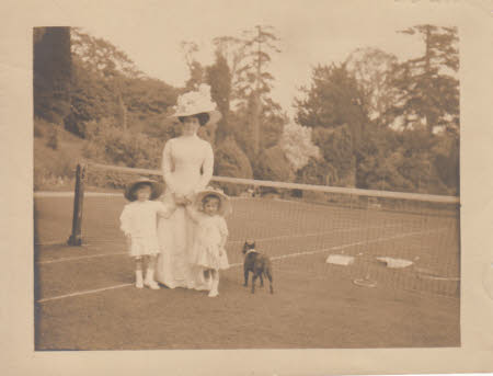 Maud Kerr-Smiley with Cyril and Elizabeth, on a tennis court.