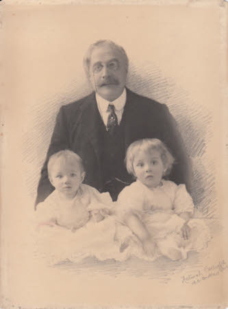 Photograph of older man with two small children, possibly Cyril and Elizabeth with their ...