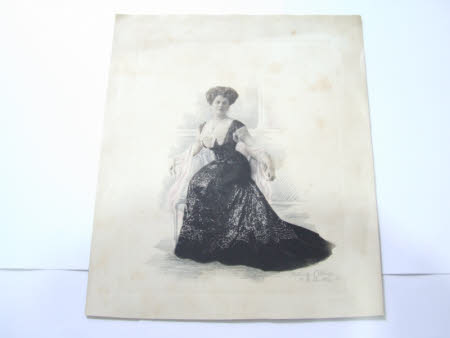 Maud Kerr-Smiley wearing a black dress with shawl, seated in a chair
