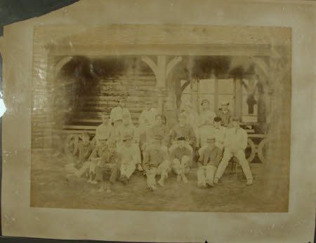 Group of men in front of a cricket pavilion including Thomas Charles Agar-Robartes, 6th Viscount ...