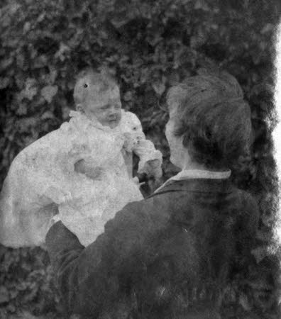 Edward Gordon Craig (1872-1966) holding his baby daughter Rosemary Nell Craig later, Mrs Robert ...
