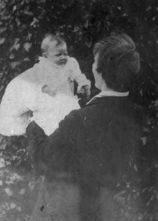 Edward Gordon Craig (1872-1966) holding his baby daughter Rosemary Nell Craig later Mrs Robert ...