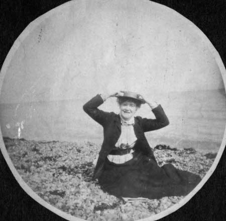 Ellen Terry (1847 - 1928) seated on beach at Winchelsea