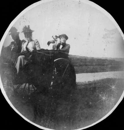Ellen Terry (1847-1928) holding her dog 'Fussie' with two other unknown females in a coster cart at ...