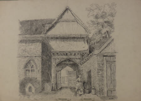 An archway with a gable over and buildings to either side